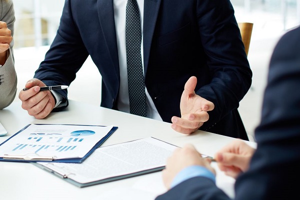 17533949 - image of business partners discussing documents and ideas at meeting